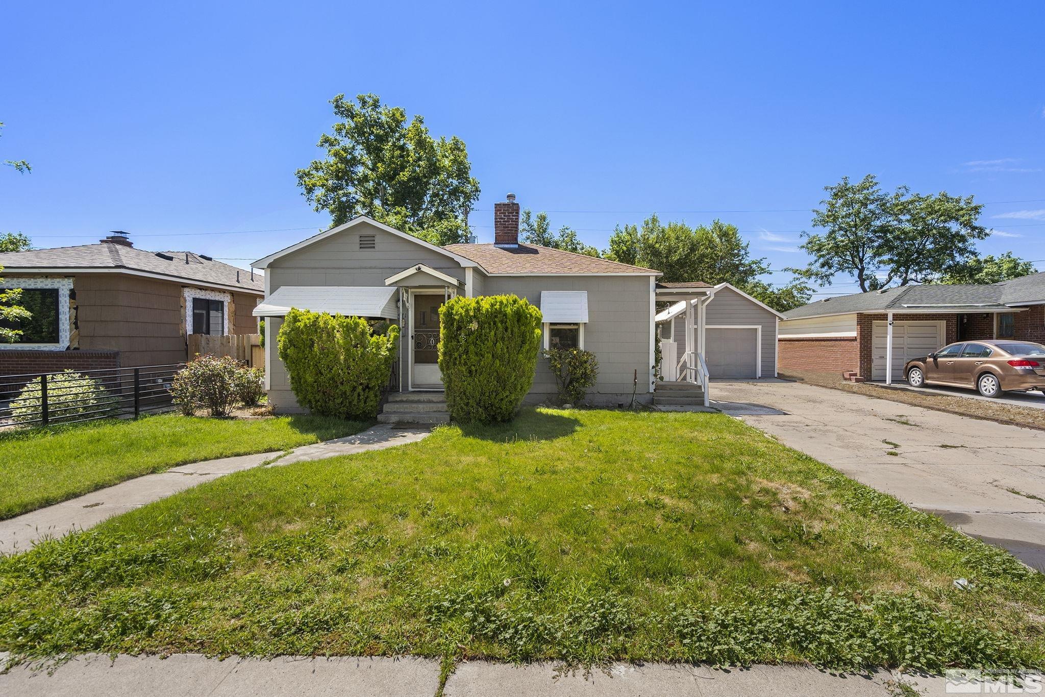 971 Lester Avenue Reno, NV 89502 - Photo 1 of 15 a view of a house with backyard and garden