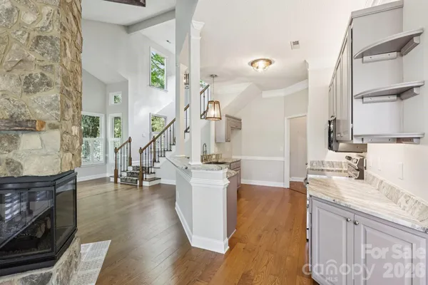 a kitchen with sink and refrigerator