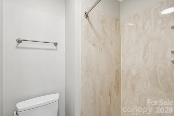 a bathroom with a shower curtain