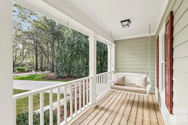 a view of a two chairs in the balcony