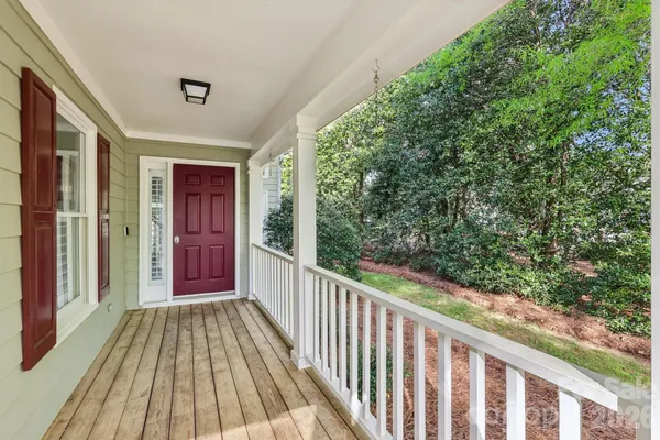 a view of a balcony with wooden floor