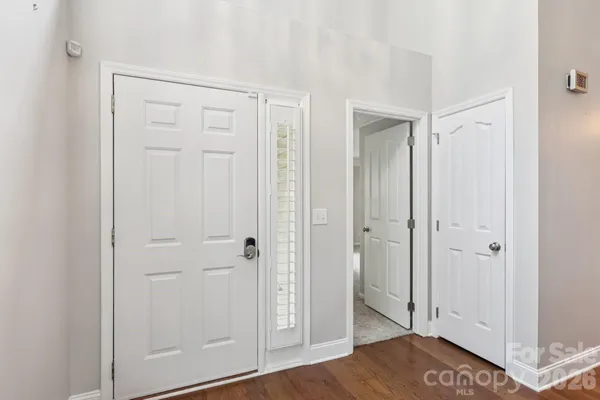 a view of a bathroom with wooden floor