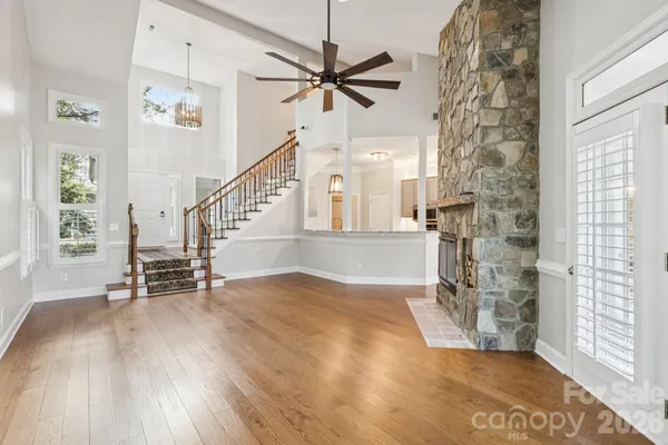 a view of entryway and hall with wooden floor