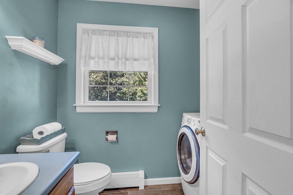 34 Pingry Way Ayer, MA 01432 - Photo 11 of 29 a white toilet sitting next to a bathroom sink and vanity