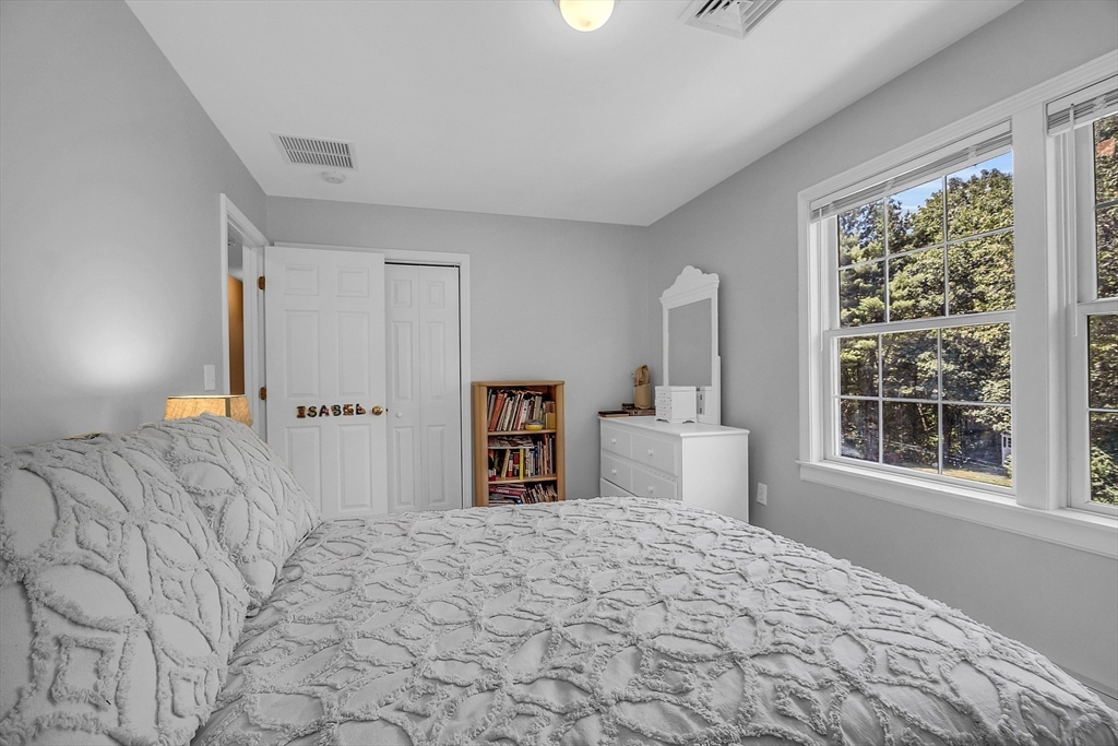 34 Pingry Way Ayer, MA 01432 - Photo 14 of 29 a bedroom with a large bed and a window