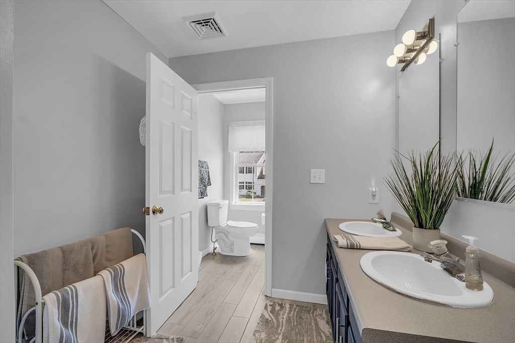 34 Pingry Way Ayer, MA 01432 - Photo 16 of 29 a bathroom with a sink and a mirror