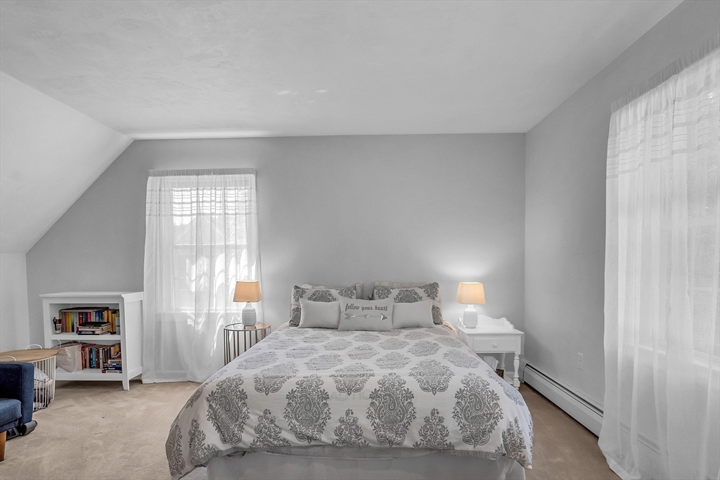 34 Pingry Way Ayer, MA 01432 - Photo 20 of 29 a bedroom with a bed and a window