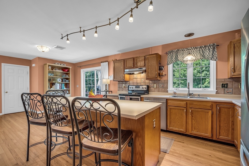 34 Pingry Way Ayer, MA 01432 - Photo 3 of 29 a view of a dining room with furniture window and outside view