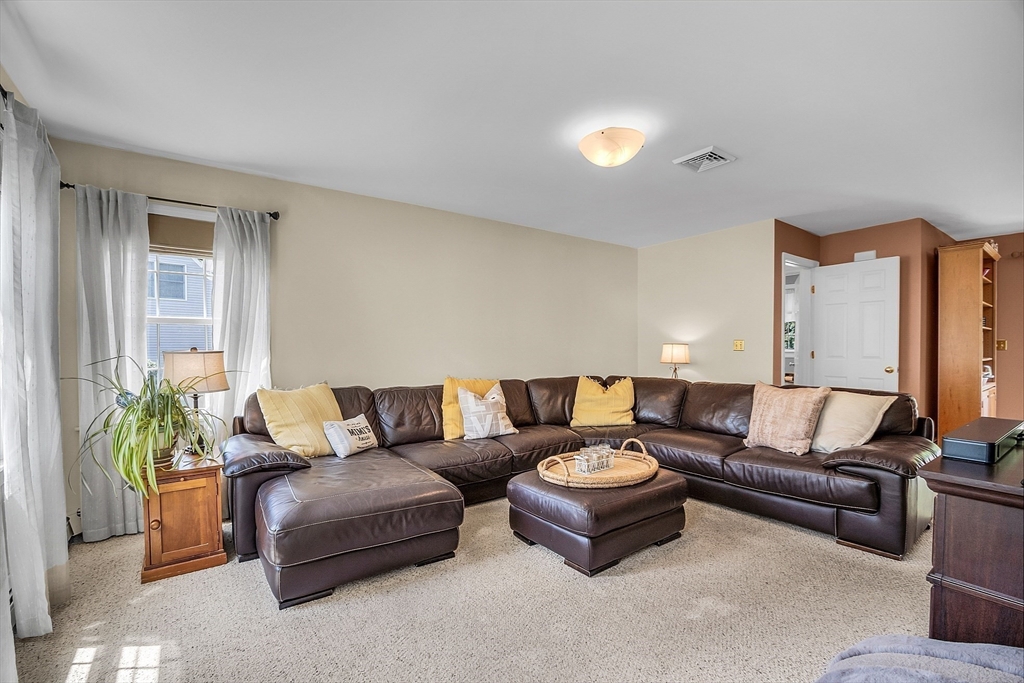 34 Pingry Way Ayer, MA 01432 - Photo 6 of 29 a living room with furniture and a potted plant
