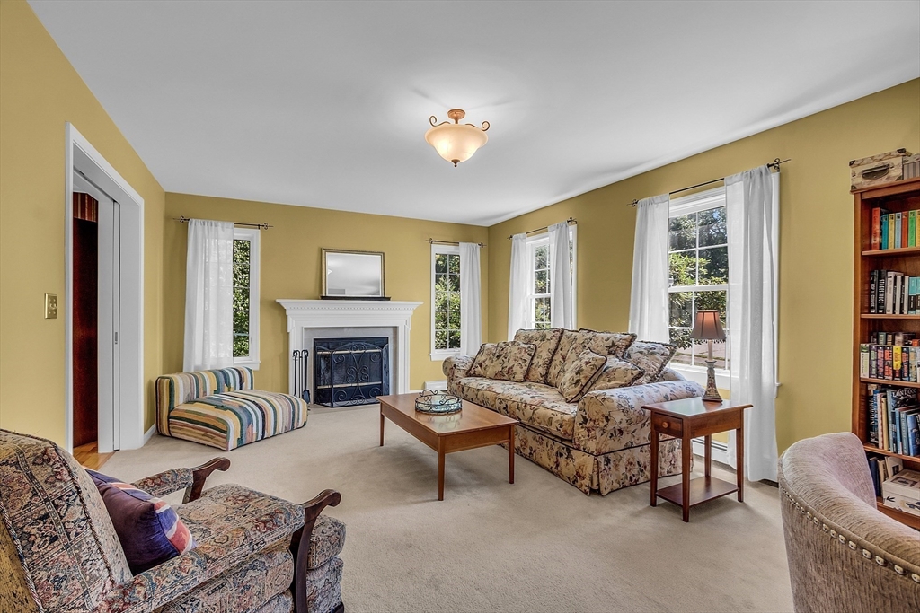 34 Pingry Way Ayer, MA 01432 - Photo 9 of 29 a living room with furniture and a fireplace