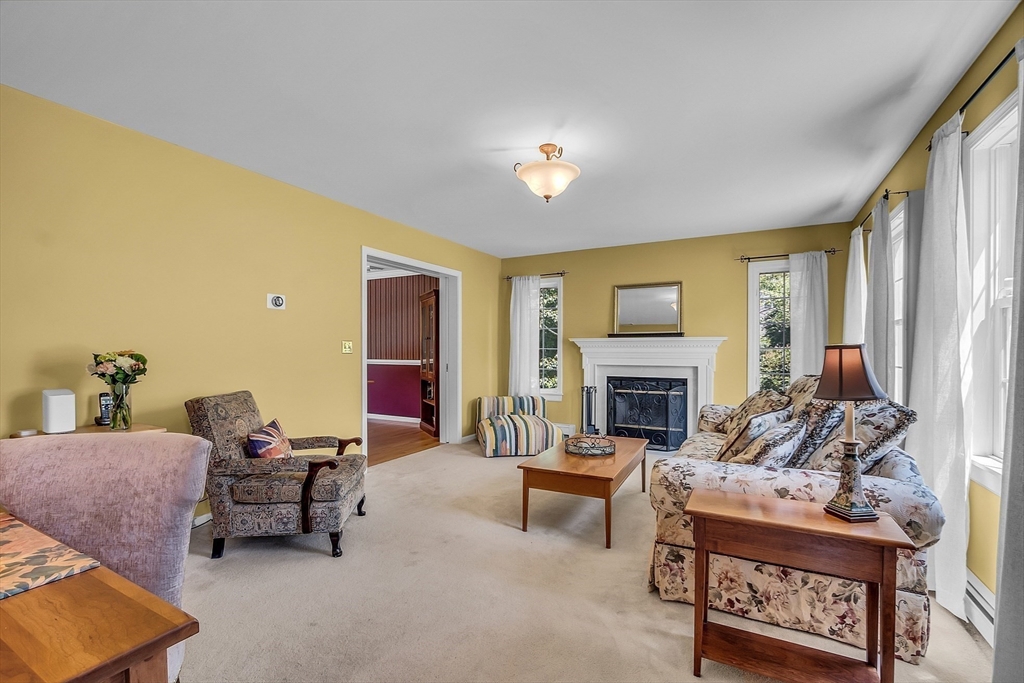 34 Pingry Way Ayer, MA 01432 - Photo 10 of 29 a living room with furniture and a fireplace