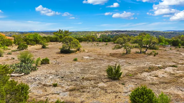 a view of a beach with a building in back