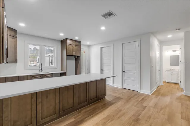 a bathroom with a sink and mirror