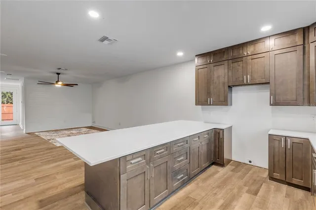 a kitchen with a stove and a refrigerator