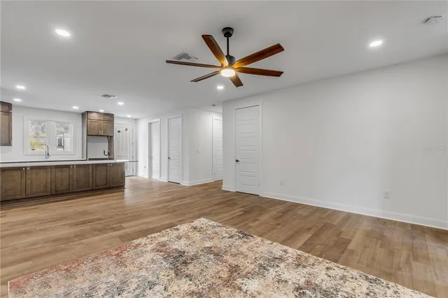 a view of a kitchen with a sink and a stove top oven