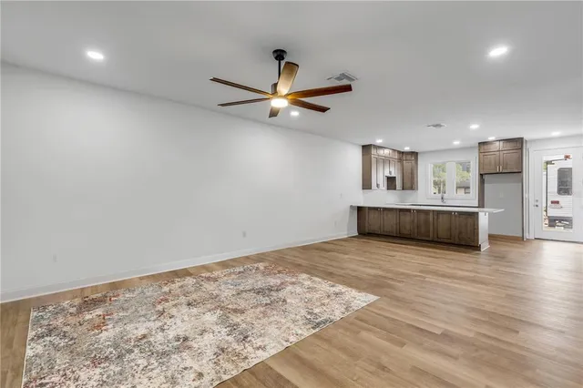 a view of a kitchen with a sink and a chandelier