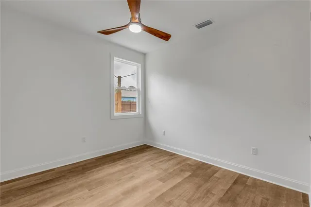 a view of empty room with fan
