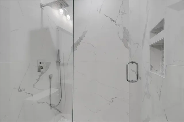 a bathroom with a granite countertop toilet a sink and a bathtub