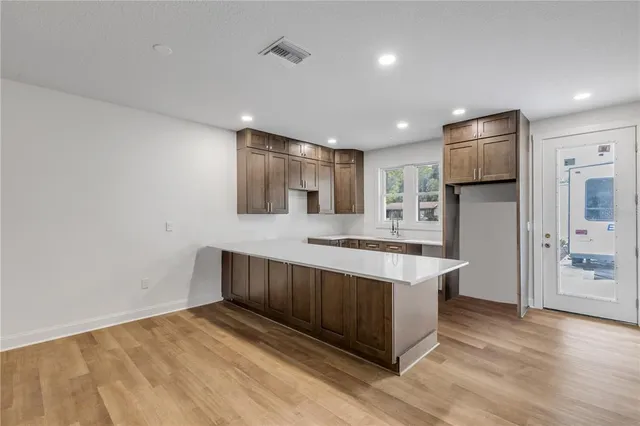 a kitchen with stainless steel appliances granite countertop a stove and a refrigerator