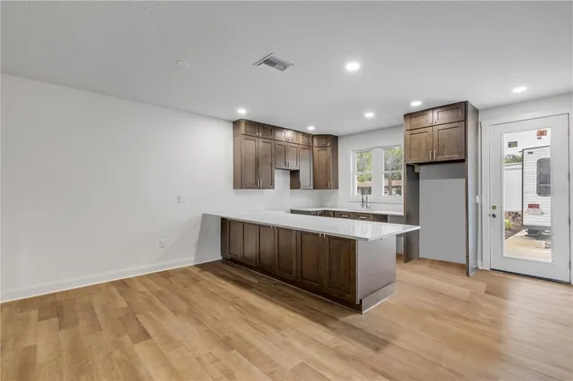a kitchen with stainless steel appliances granite countertop a stove and a refrigerator