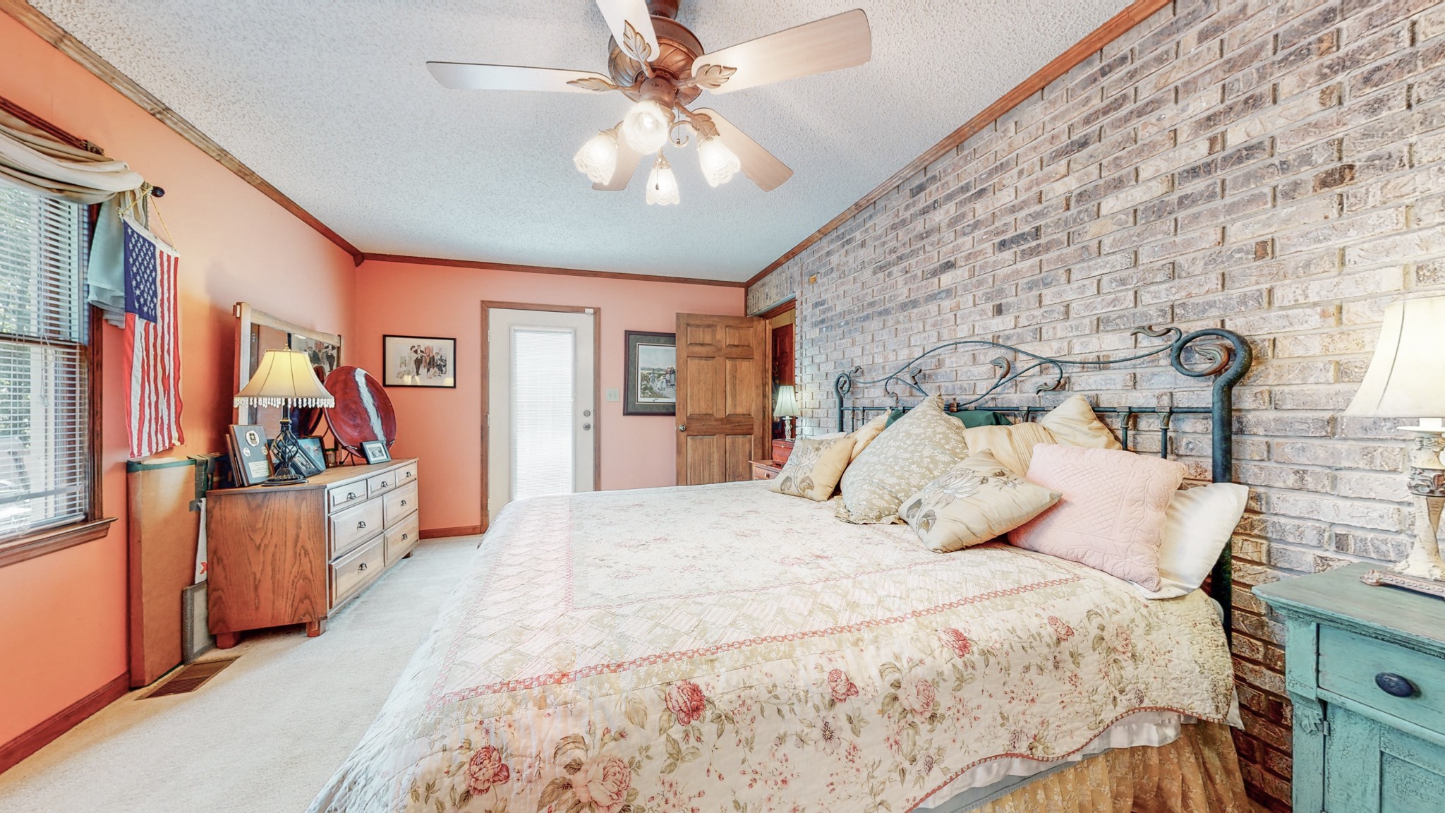 85 Sarvis Ridge Road Normandy, TN 37360 - Photo 14 of 47 a bedroom with a large bed and a chandelier