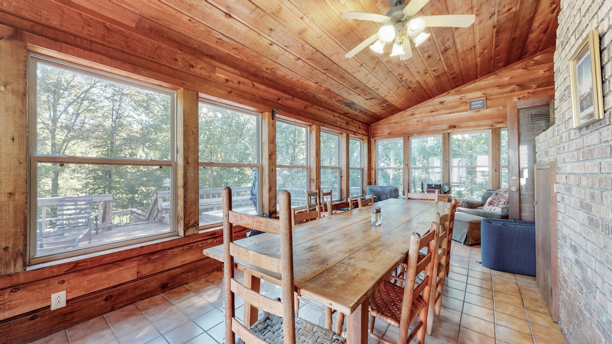 85 Sarvis Ridge Road Normandy, TN 37360 - Photo 17 of 47 a dining room with furniture large windows and a chandelier