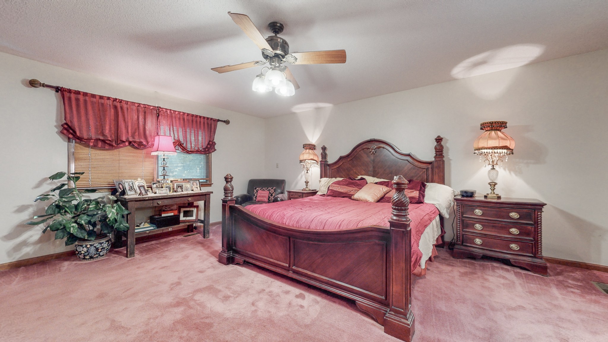 85 Sarvis Ridge Road Normandy, TN 37360 - Photo 20 of 47 a bedroom with a bed and a chandelier