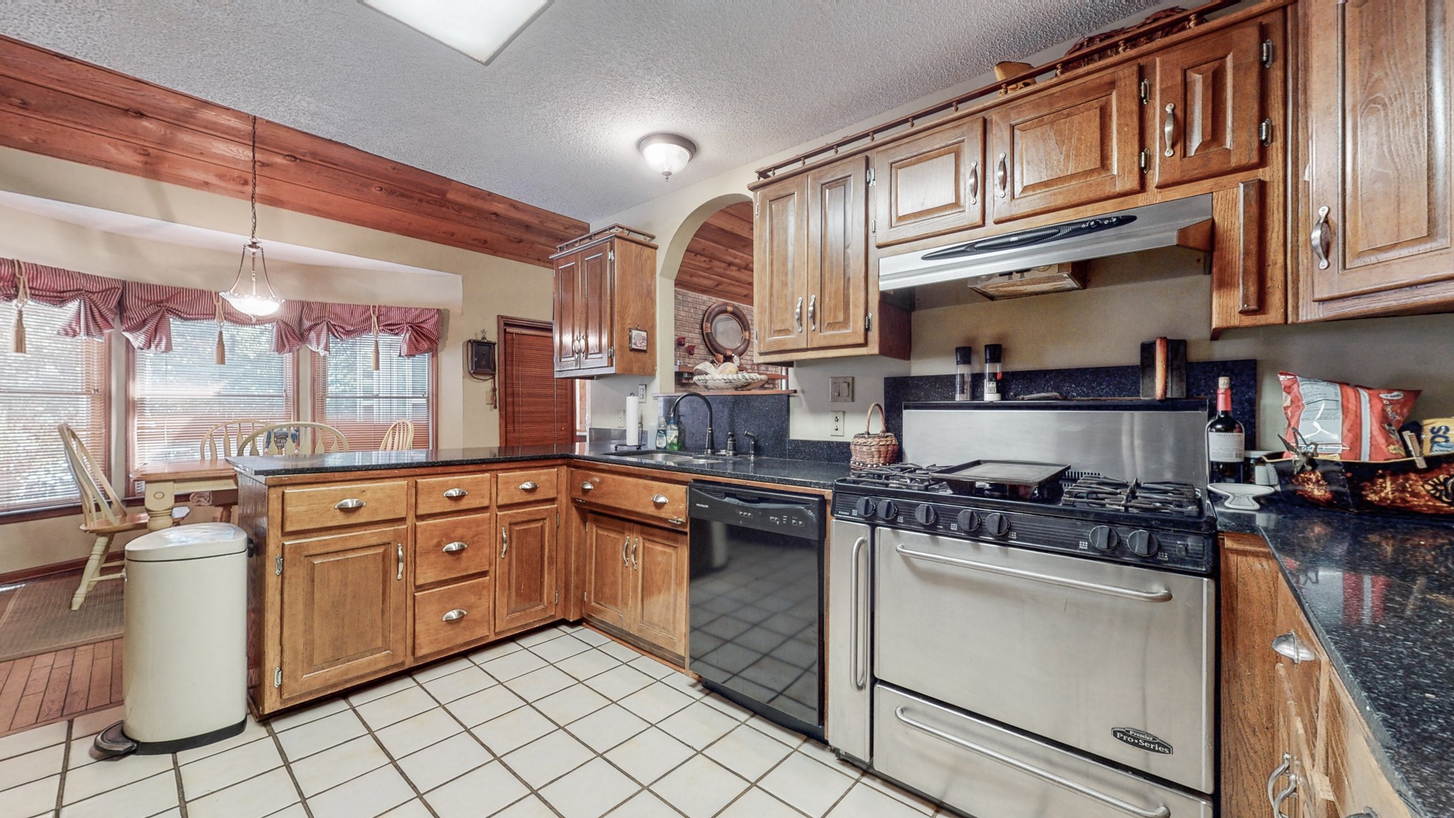 85 Sarvis Ridge Road Normandy, TN 37360 - Photo 10 of 47 a kitchen with stainless steel appliances granite countertop a stove and a sink