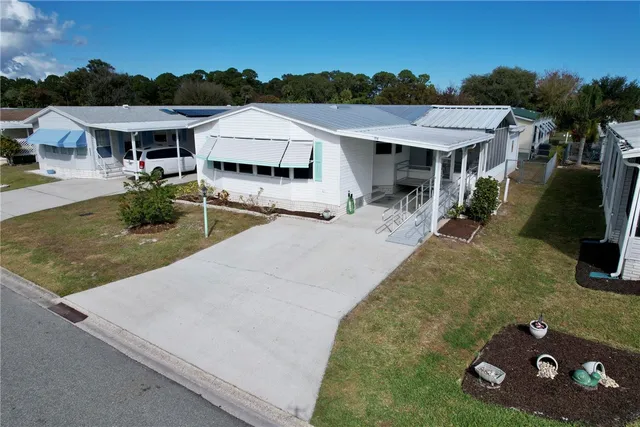 an aerial view of a house with garden space