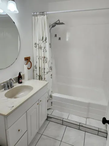 a bathroom with a sink and a mirror