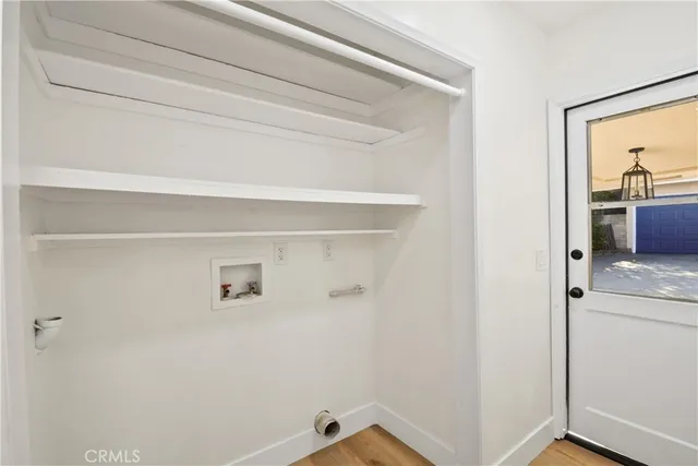 a view of storage and utility room with closet