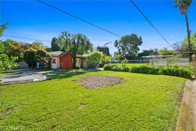a view of a swimming pool with a yard