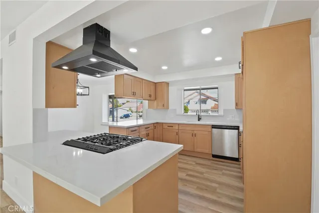 a kitchen with a stove and a refrigerator