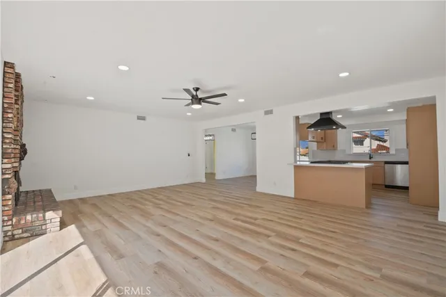 a view of a kitchen with a sink and a stove top oven