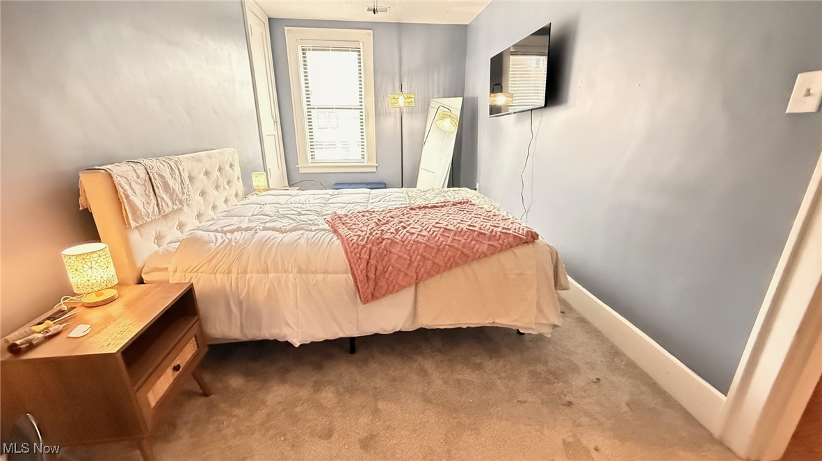1 South Main Street Rittman, OH 44270 - Photo 13 of 13 Carpeted bedroom with baseboards