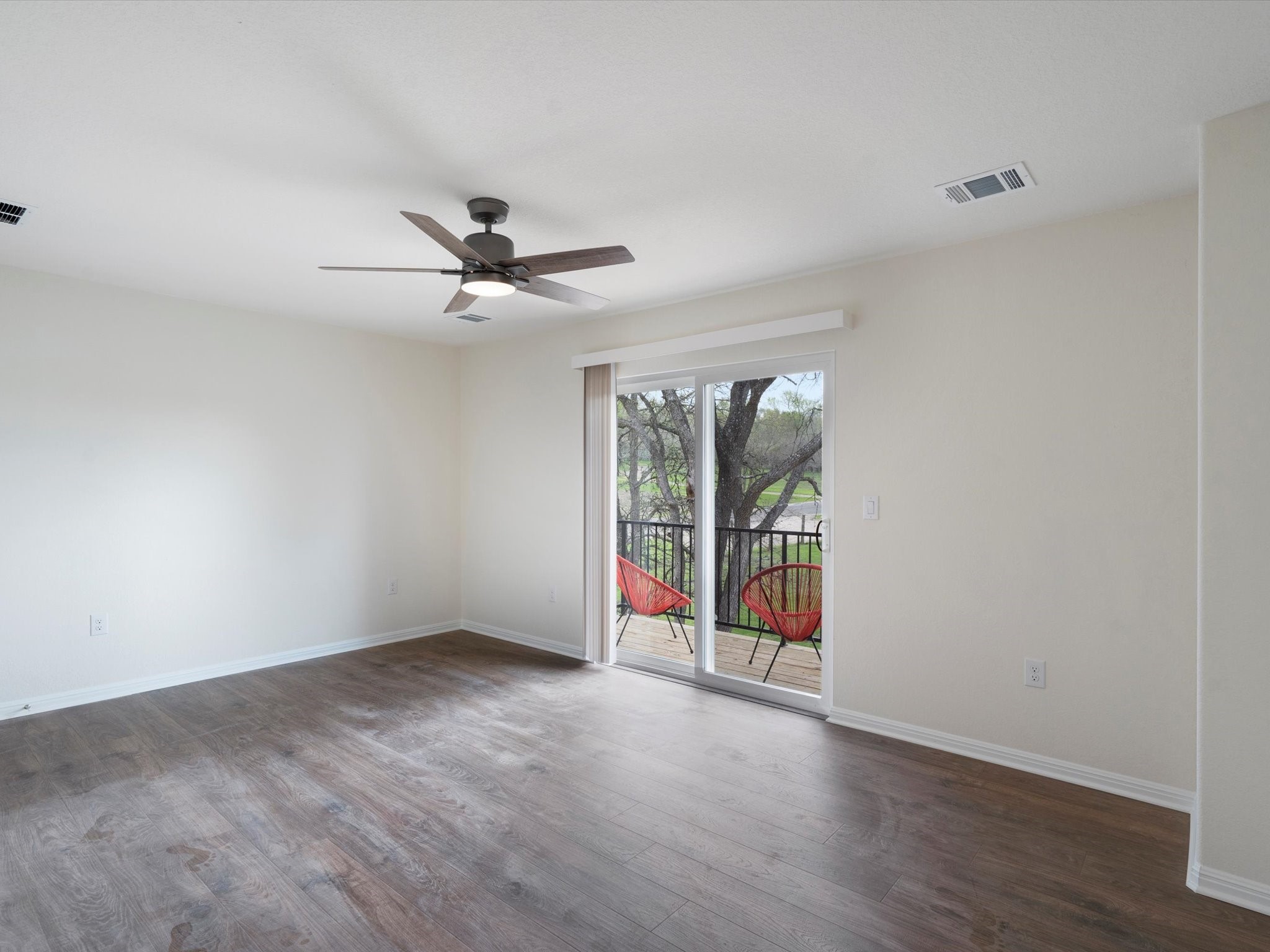 21007 Coleman Branch Creek Road Manor, TX 78653 - Photo 22 of 31 Spacious primary bedroom with natural light and peaceful views.
