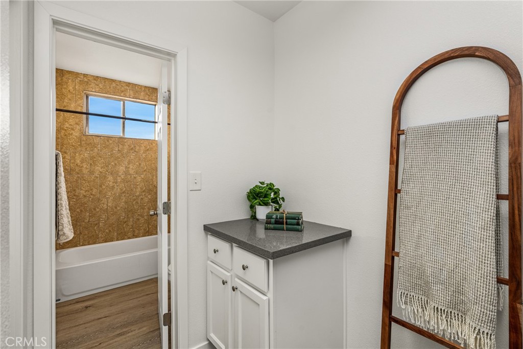 6725 Perry Road Bell Gardens, CA 90201 - Photo 28 of 40 a living room with a sink and a mirror