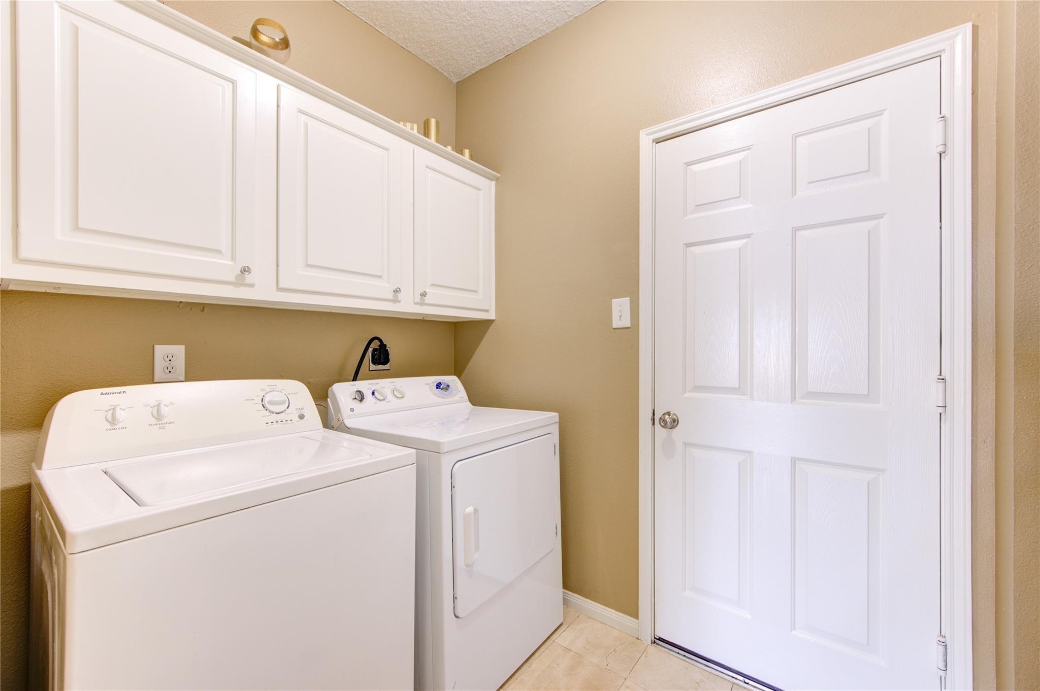 14420 Walters Road, Unit 58 Houston, TX 77014 - Photo 12 of 30 a utility room with dryer and washer