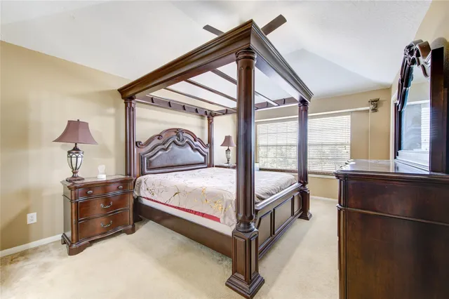 a bathroom with a tub a sink and a mirror