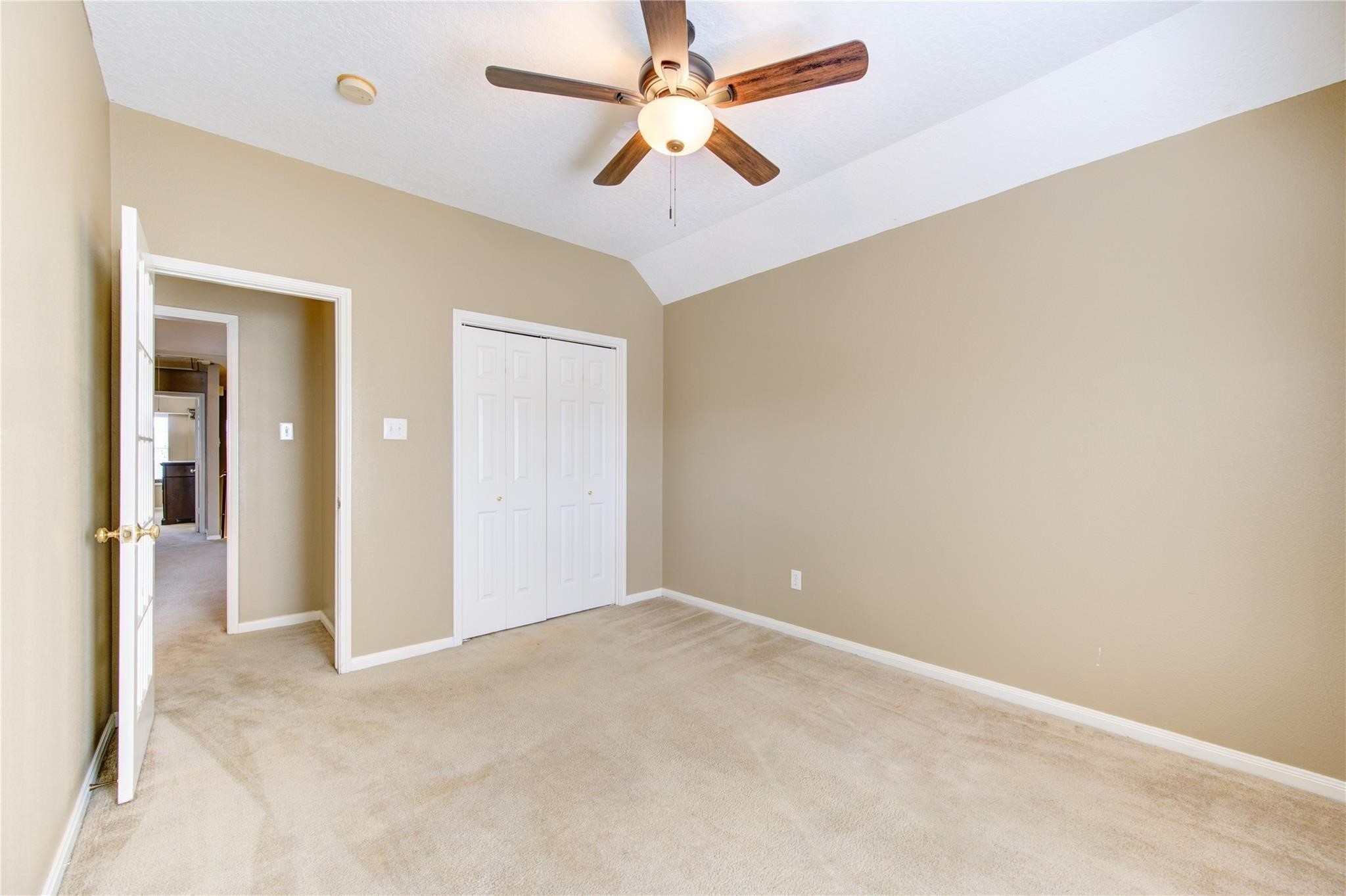 14420 Walters Road, Unit 58 Houston, TX 77014 - Photo 20 of 30 an empty room with fan and entrance