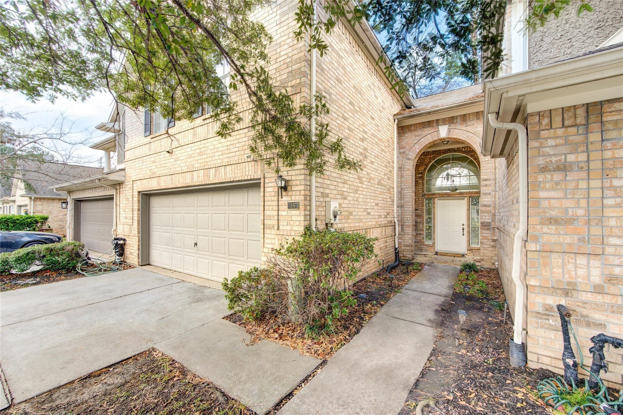14420 Walters Road, Unit 58 Houston, TX 77014 - Photo 2 of 30 a front view of a house with garden