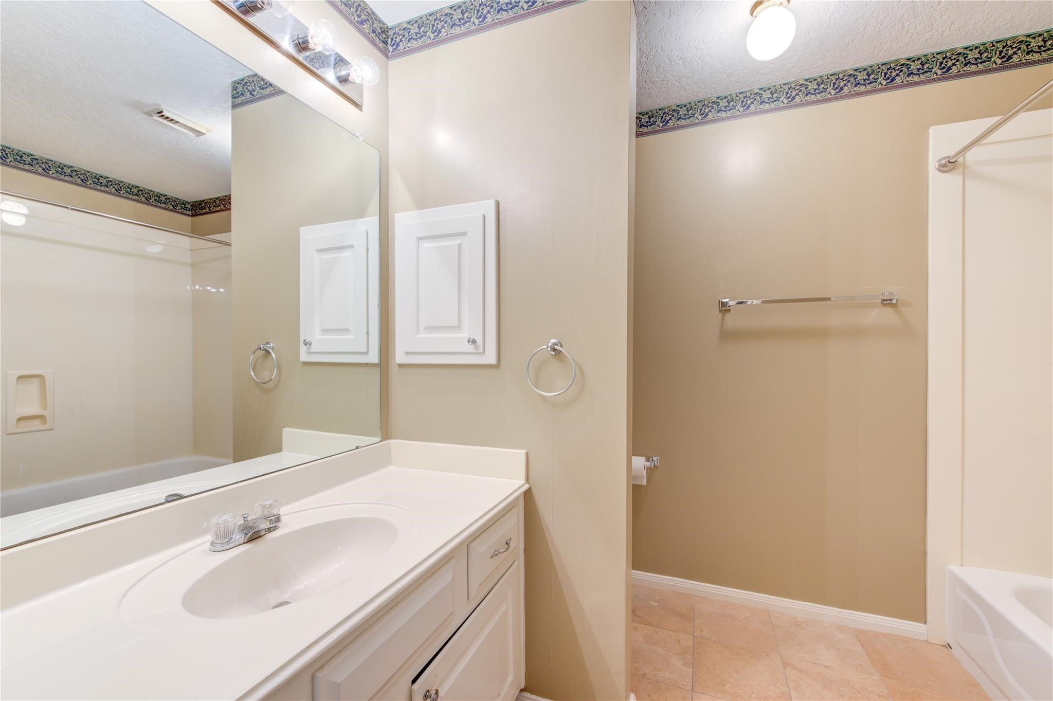 14420 Walters Road, Unit 58 Houston, TX 77014 - Photo 21 of 30 a bathroom with a sink and a mirror