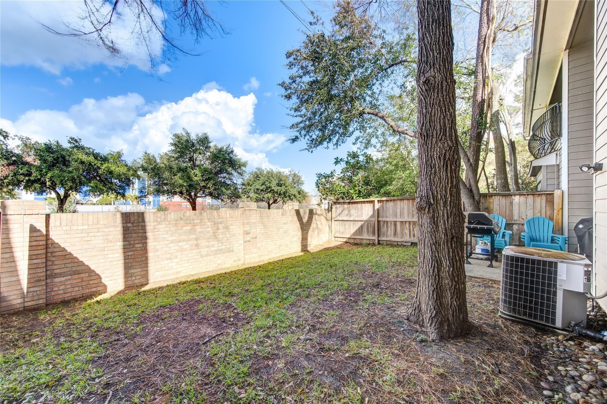 14420 Walters Road, Unit 58 Houston, TX 77014 - Photo 27 of 30 a view of backyard space and trees