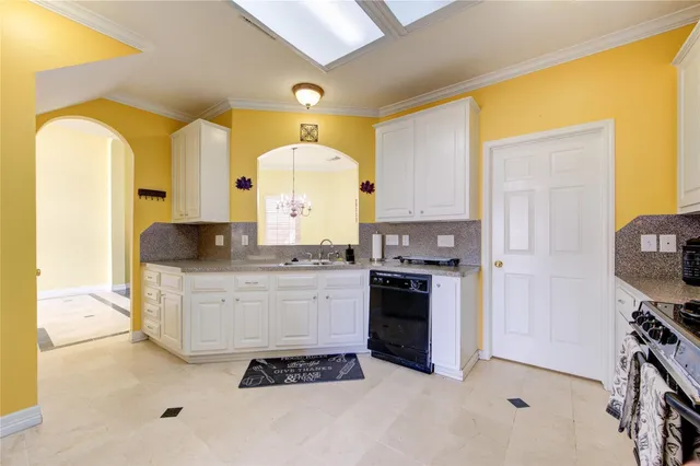 a kitchen with a refrigerator and a stove top oven