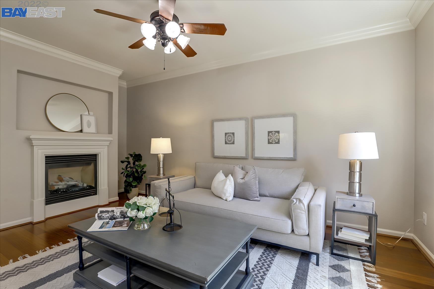 8907 San Ramon Road Dublin, CA 94568 - Photo 1 of 1 a living room with furniture and a fireplace
