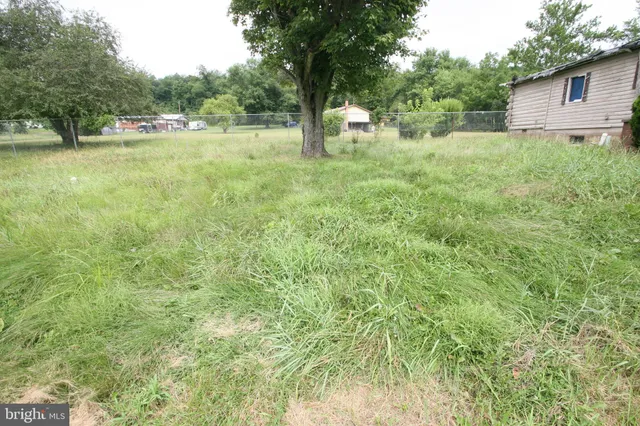 a view of backyard with outdoor space