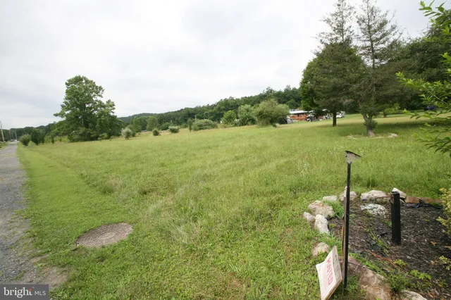 a view of a lake with a yard