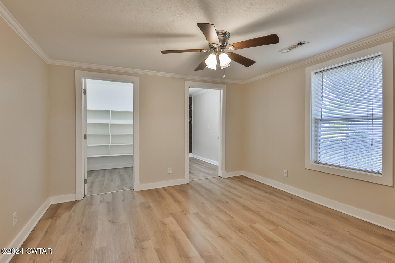 246 Thomas Street Dyer, TN 38330 - Photo 12 of 19 a view of an empty room with a window and wooden floor