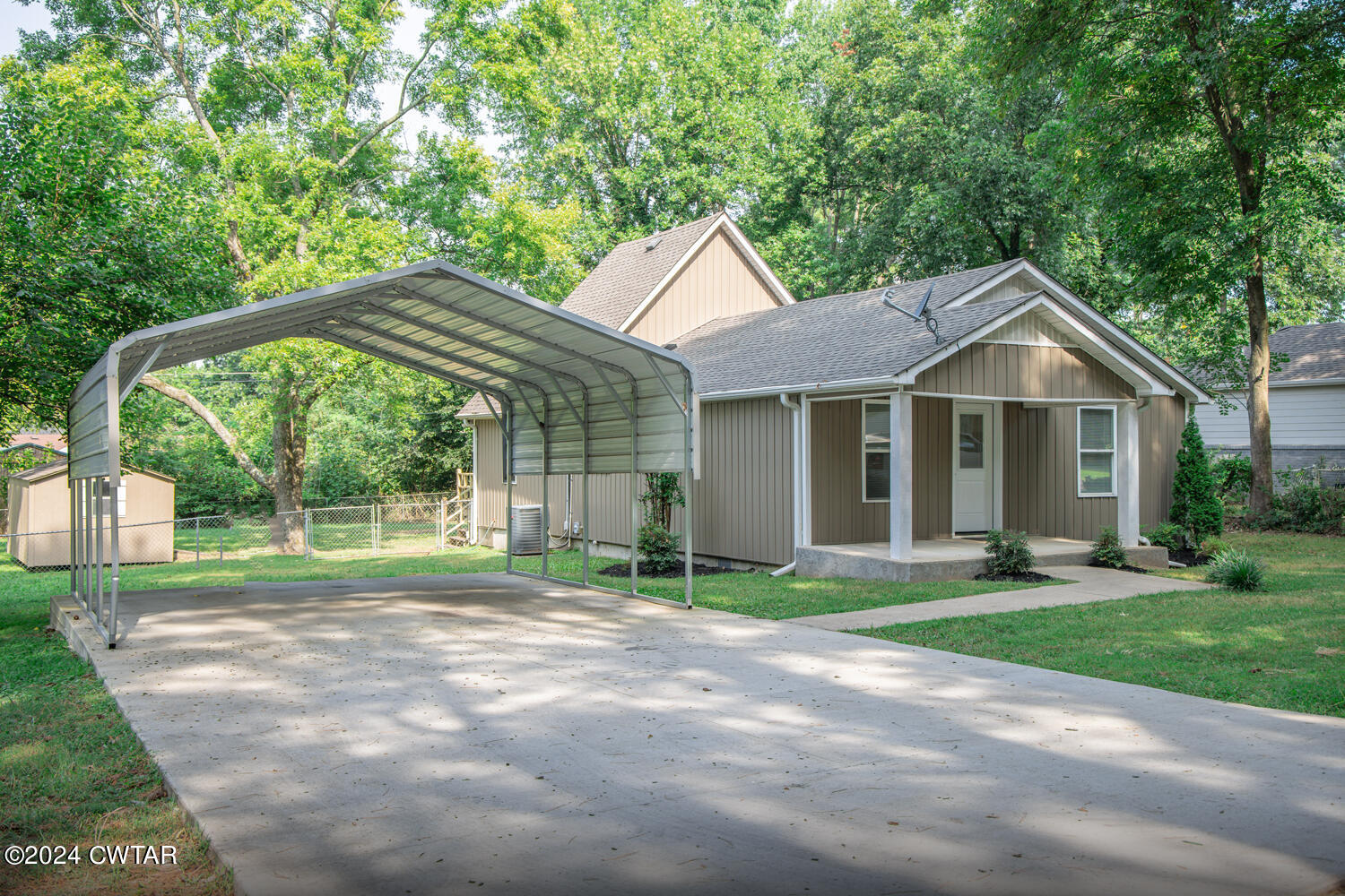 246 Thomas Street Dyer, TN 38330 - Photo 3 of 19 a front view of a house with a yard