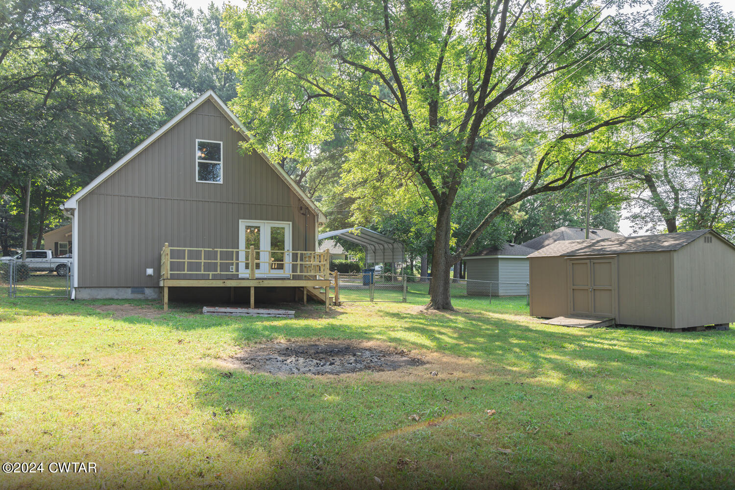 246 Thomas Street Dyer, TN 38330 - Photo 5 of 19 a view of a house with a yard and sitting area